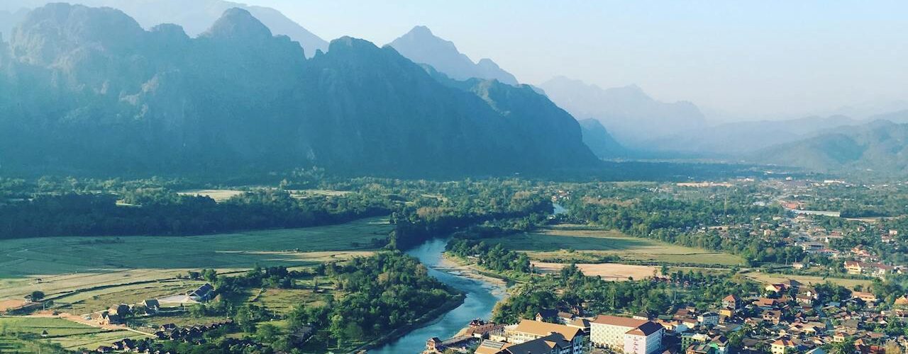 Hot air balloon drifting above the town of Vang Vieng, Laos